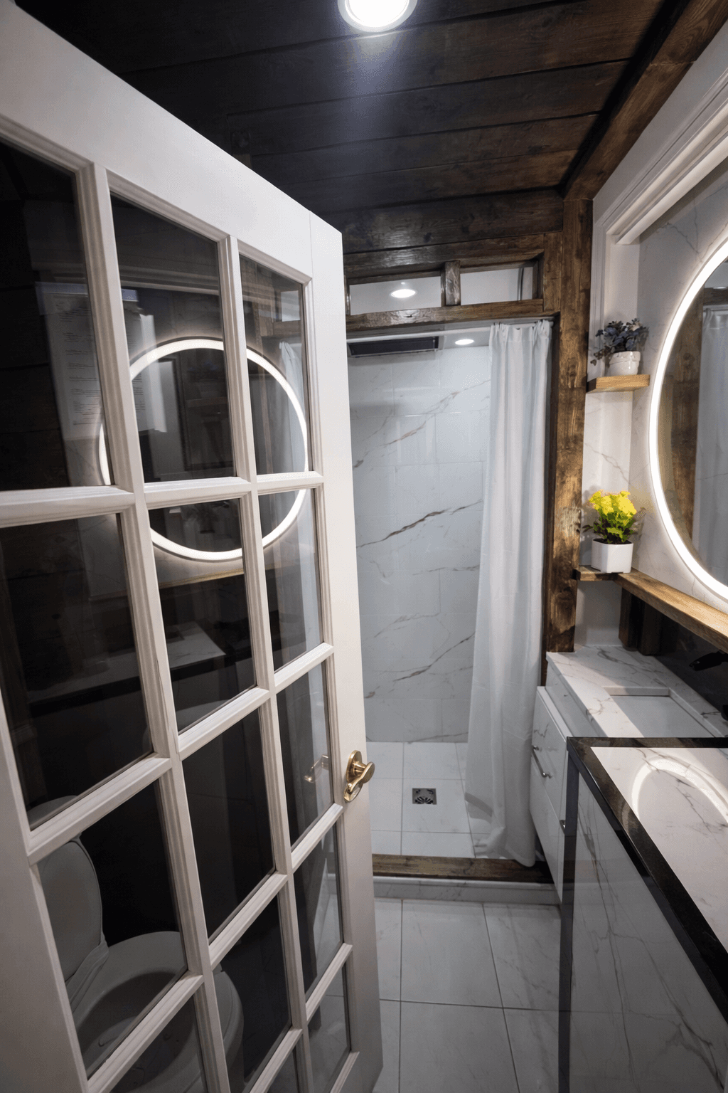 Bathroom view with shower and vanity.