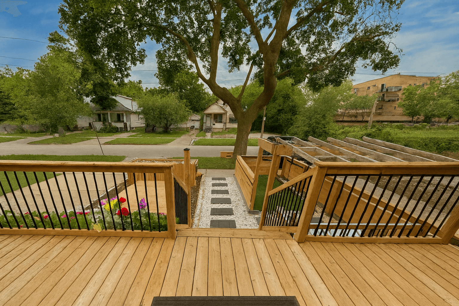 Front deck with updated wood and railing.