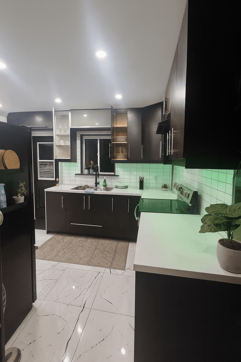 Updated kitchen with modern cabinets and backsplash.